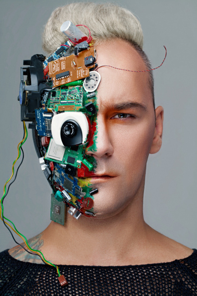 Studio photo of man cyborg, half face computer elements and with professional make-up, white Iroquois on head. Future technology concept - Photo, Image
