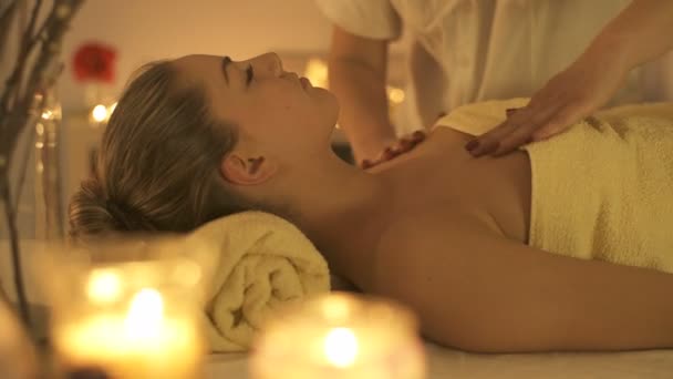 Beautiful Young Woman Relaxing receiving Facial Body Massage Beauty Spa. - Felvétel, videó