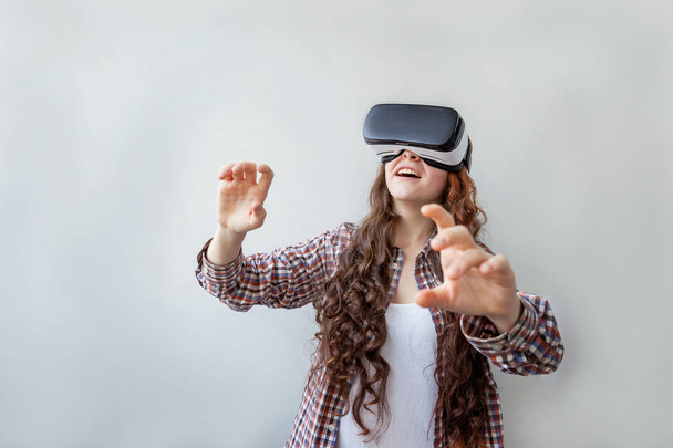Woman using VR headset - Фото, изображение
