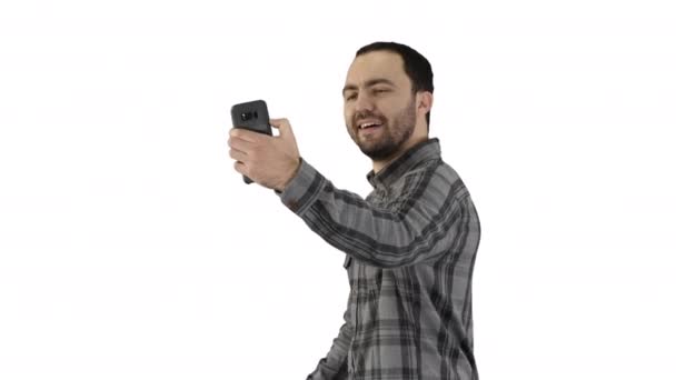 Teenage boy making a selfie when walking on white background. - Metraje, vídeo