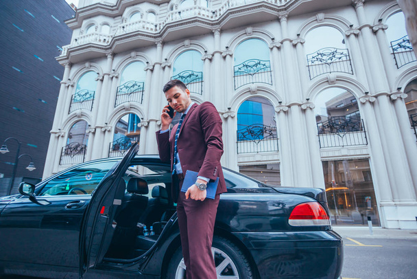 Entrepreneur Businessman standing in an urban area next to his l - Foto, Imagen