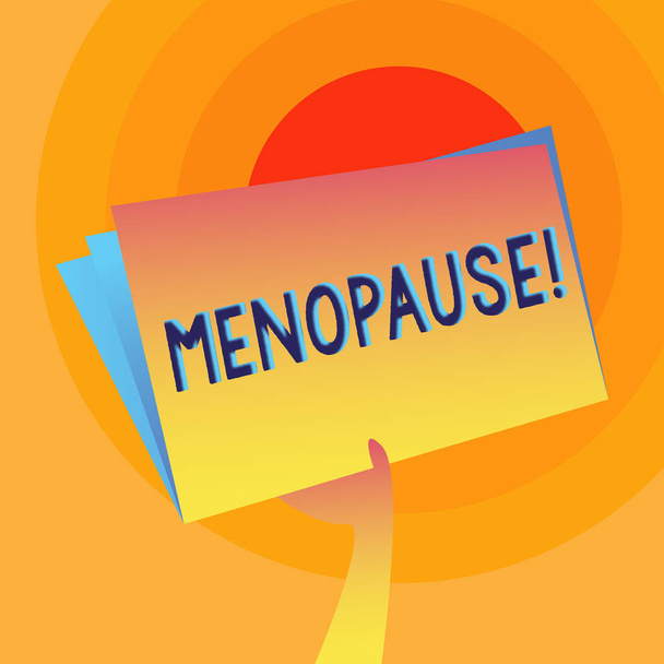 Word pisanie tekstu menopauzy. Koncepcja biznesowa dla zaprzestania miesiączki starszych kobiet hormonalne zmiany okresu trzymając rękę i podnoszenie puste miejsca kolorowy Folder plików z arkusza wewnątrz. - Zdjęcie, obraz