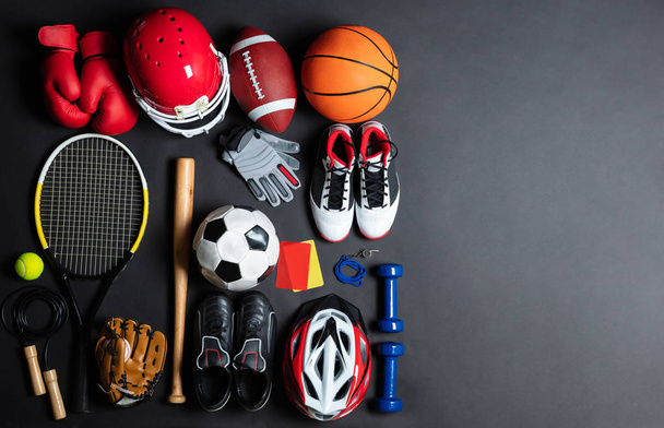 High Angle View Of Various Sport Equipment On Black Background - Foto, Imagem