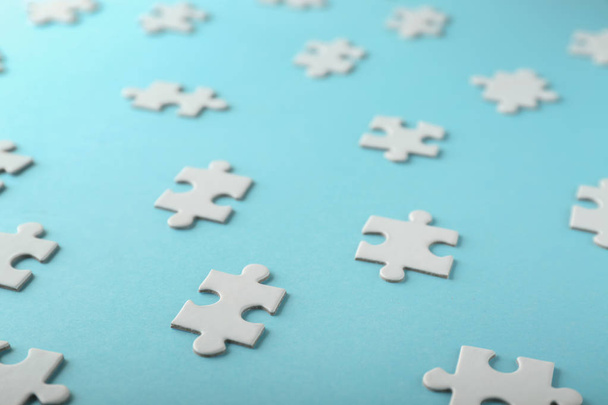 Pieces of jigsaw puzzle on color background - Photo, Image