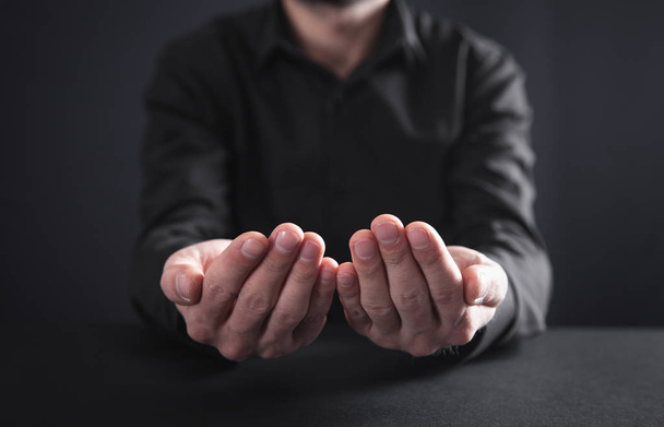 Man showing empty hands. Giving gesture - Fotó, kép