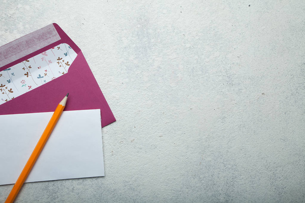 A love letter with a pink envelope on a white background. Empty  - Zdjęcie, obraz