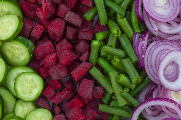 Fresh chopped  vegetables bright background - Valokuva, kuva