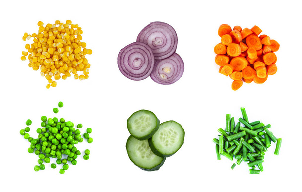 Heaps of different cut vegetables isolated on white background.  - Фото, зображення
