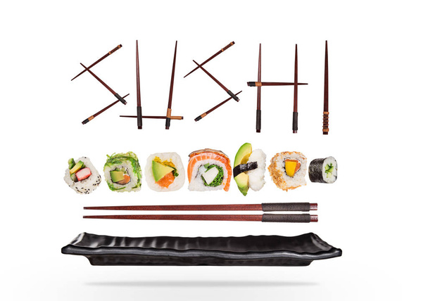 Pieces of delicious japanese sushi frozen in the air. - Foto, immagini