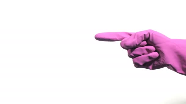 Lila Gumikesztyű kéz felé mutat a fehér háttér - Felvétel, videó