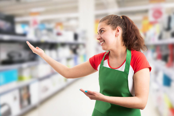 Supermarket employee presenting invisible product - Photo, image