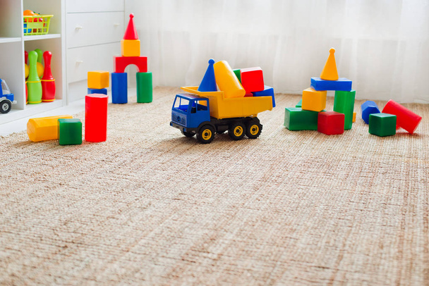 Children's playroom with plastic colorful educational blocks toys. - Фото, зображення