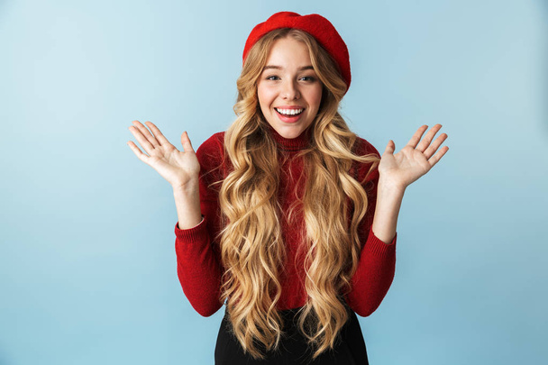 Image of positive blond woman 20s wearing red beret laughing and - Zdjęcie, obraz