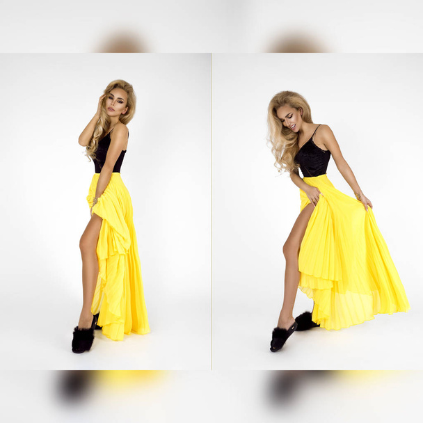 Modefoto einer schönen eleganten jungen Frau in einem hübschen, femininen gelben Rock, der über weißem Hintergrund posiert. - Foto, Bild