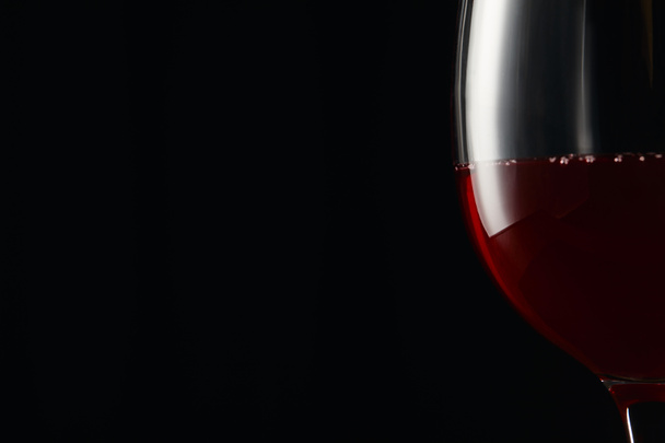 Glass with burgundy red wine isolated on black - Photo, Image