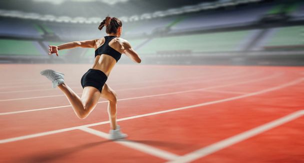 Sportswoman running race. Mixed media - Zdjęcie, obraz