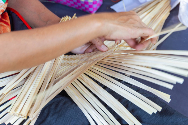 The villagers took bamboo stripes to weave into different forms for daily use utensils of the communitys people in Bangkok Thailand, Thai handmade product.   - Photo, Image