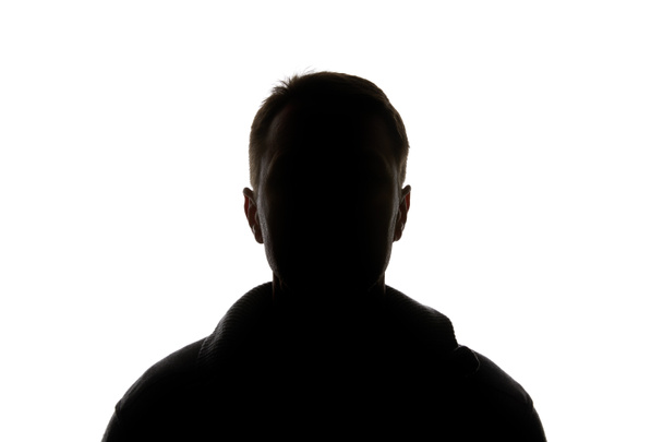 Silhouette of man looking at camera isolated on white - Photo, Image