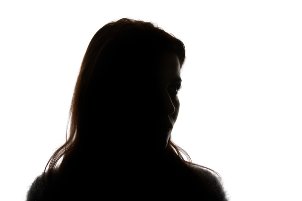 Silueta de mujer mirando hacia otro lado aislada en blanco
 - Foto, imagen