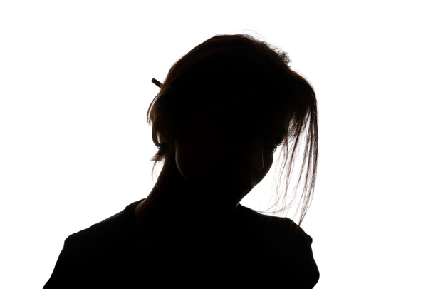 Silhouette of woman looking at camera isolated on white - Foto, immagini