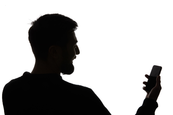 Silhouette di uomo in possesso di smartphone con schermo bianco isolato su bianco
 - Foto, immagini