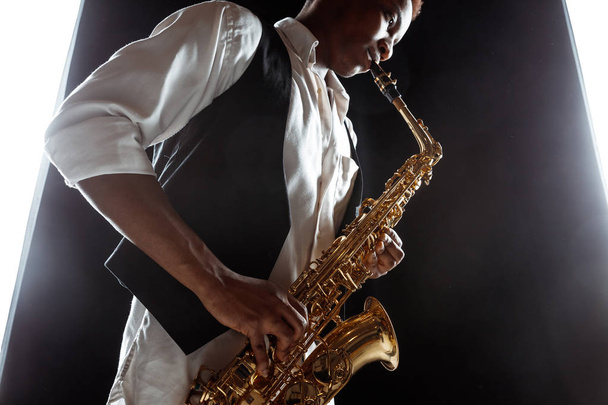 African American jazz musician playing the saxophone. - Foto, Bild