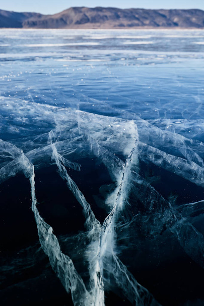 ice and cracks on the surface of Lake Baikal, Winter - Fotoğraf, Görsel