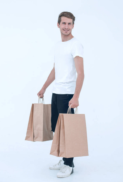 Guy satisfied carries bag - Zdjęcie, obraz