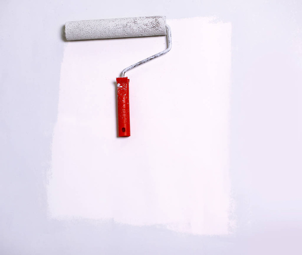 paint roller painting on white paper.background. place for text - Photo, image