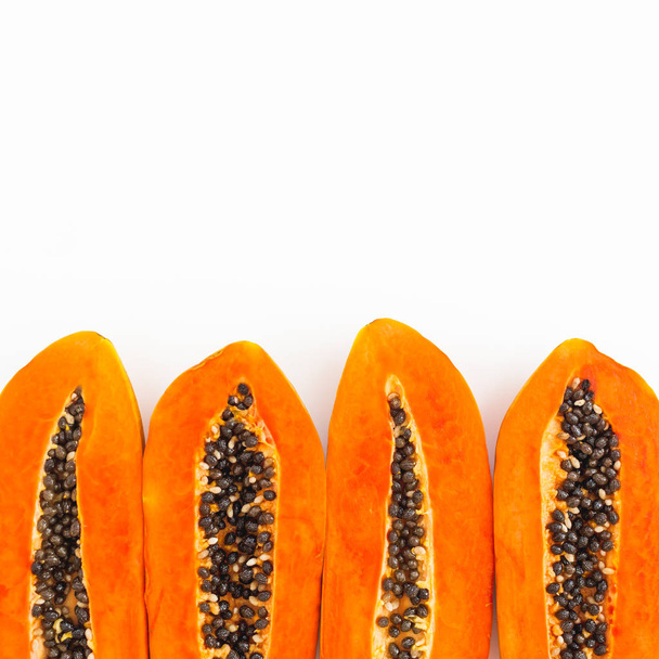 Slices of tasty papaya on white background. Flat lay. Top view. Fruit concept - Photo, Image