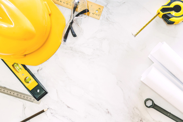 Construction tools with helmet safety on white marble background - Photo, Image
