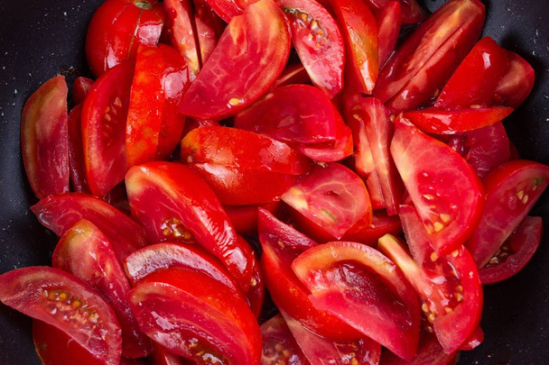 tomato frying on pan, cooking vegetable sauce,  food. - Valokuva, kuva