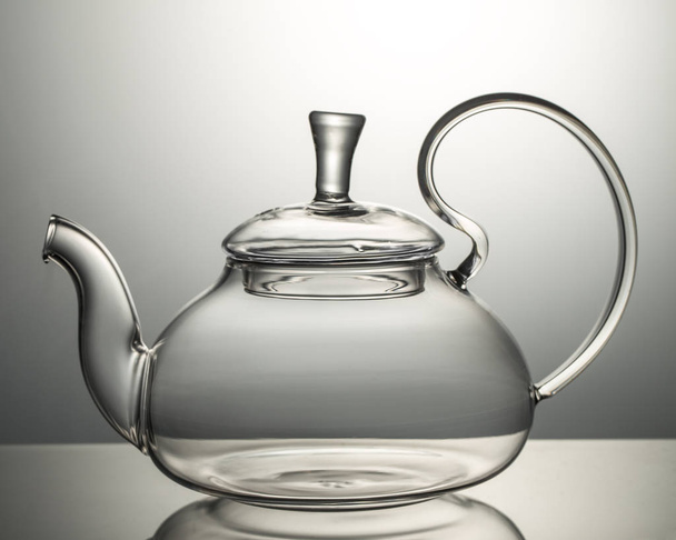 Empty glass teapot on a gray background  - Zdjęcie, obraz