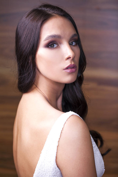 Portrait close up of young beautiful brunette woman in white dre - Foto, immagini