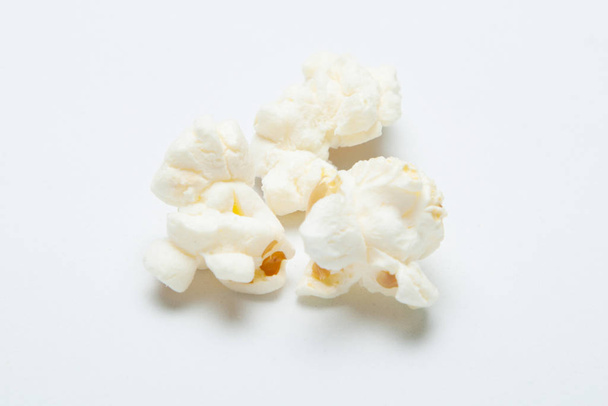 Close-up, popcorn on white background. - Foto, imagen