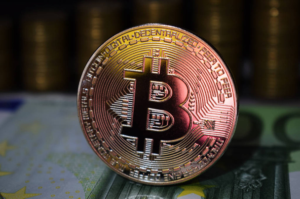 Physical Bitcoin BTC coin on a background with money - Photo, Image