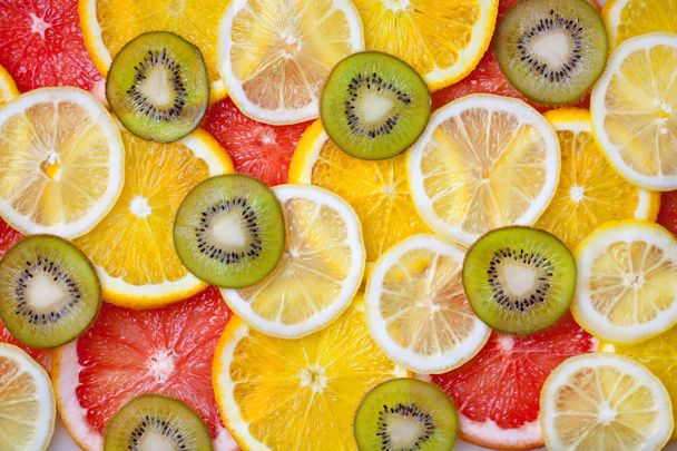 Fresh sliced mixed citrus fruits like background, concept of healthy eating, dieting, top view. Background. - Foto, immagini