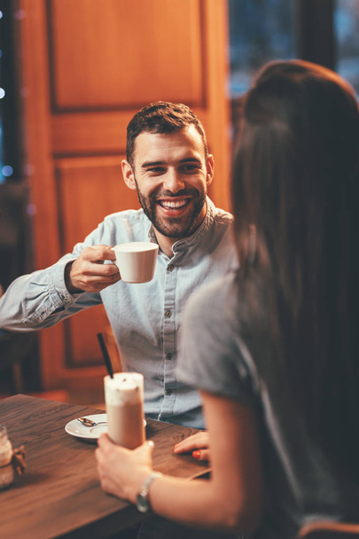 Romantic loving couple drinking coffee having date in cafe - Zdjęcie, obraz