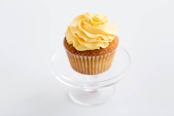 cupcake with frosting on confectionery stand - Photo, Image