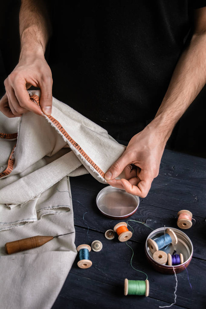 Male tailoring, measuring fabrics. - Photo, Image