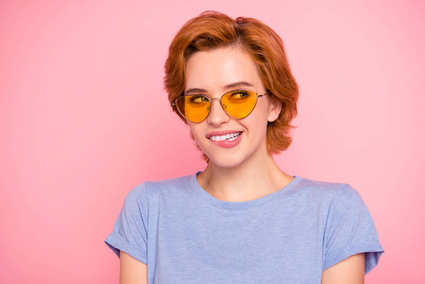 Close-up portrait of her she nice cute charming attractive lovely sweet cheerful funny curios girl wearing casual t-shirt yellow glasses biting lip thinking looking aside isolated over pink background - Fotografie, Obrázek