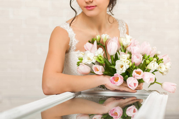 Portrait of beautiful bride with wedding bouquet - Photo, Image