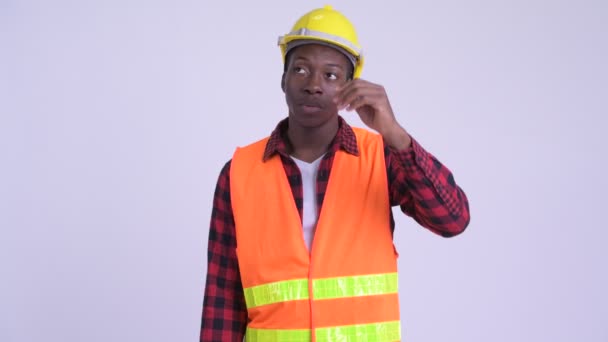 Young stressed African man construction worker getting bad news - Filmagem, Vídeo
