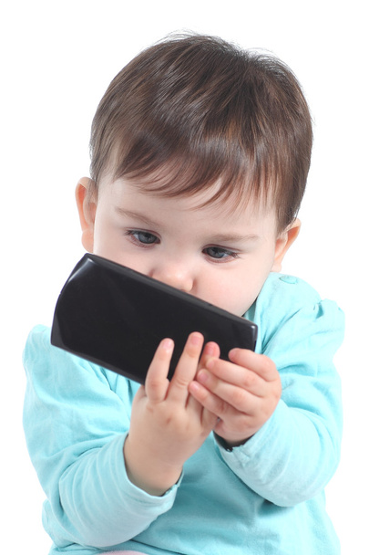 Casual baby watching attentive a mobile phone - Foto, Bild
