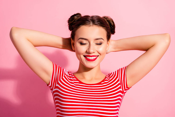 Close up photo beautiful she her lady pretty buns eyes closed dreamer having nap arms hands behind head weekend day off making wish wear casual striped red white t-shirt isolated pink background - Foto, Bild