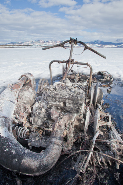 Bizarre burnt out snowmobile on Yukon lake Canada - Photo, Image