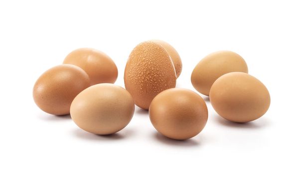 A group of eggs surroundding to one egg with sweat  - Foto, Imagem