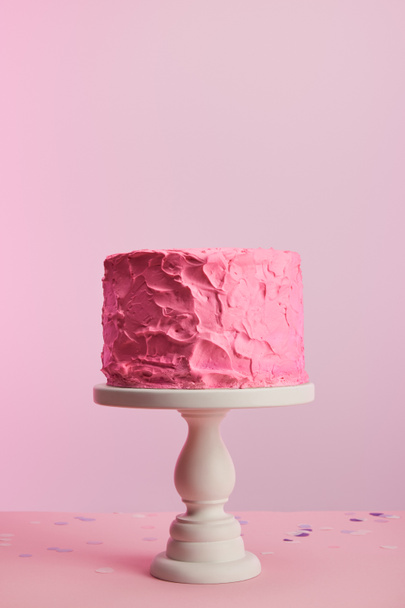 delicious pink birthday cake on cake stand isolated on pink - Zdjęcie, obraz