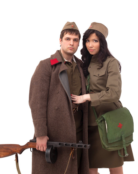 Attractive man and woman posing in khaki - Photo, Image