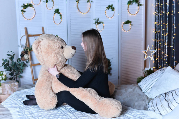 young beautiful woman posing   with big teddy bear  - Φωτογραφία, εικόνα